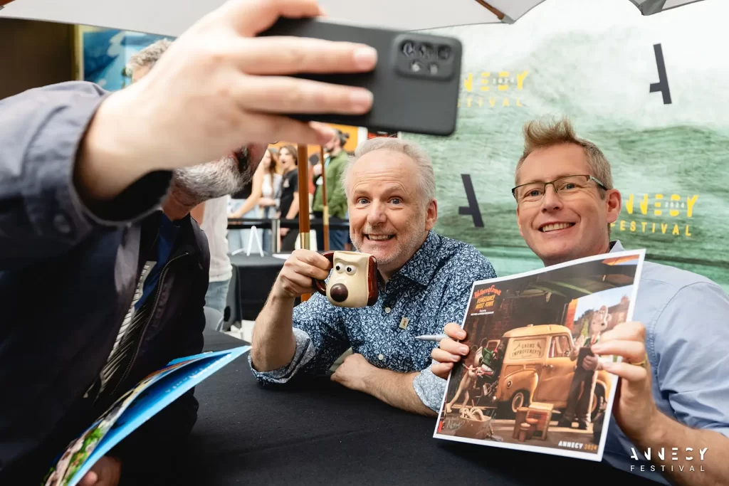 Aardmans Nick Park und Merlin Crossingham signieren für den neuen Wallace and Gromit Film